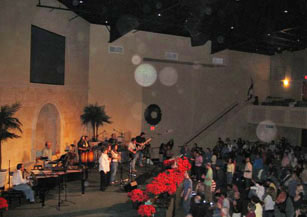 Side view of a stage cross, with circular light spots (angel orbs) in the photograph
