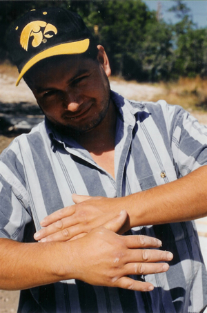 Jose showing another person's hands outdoors